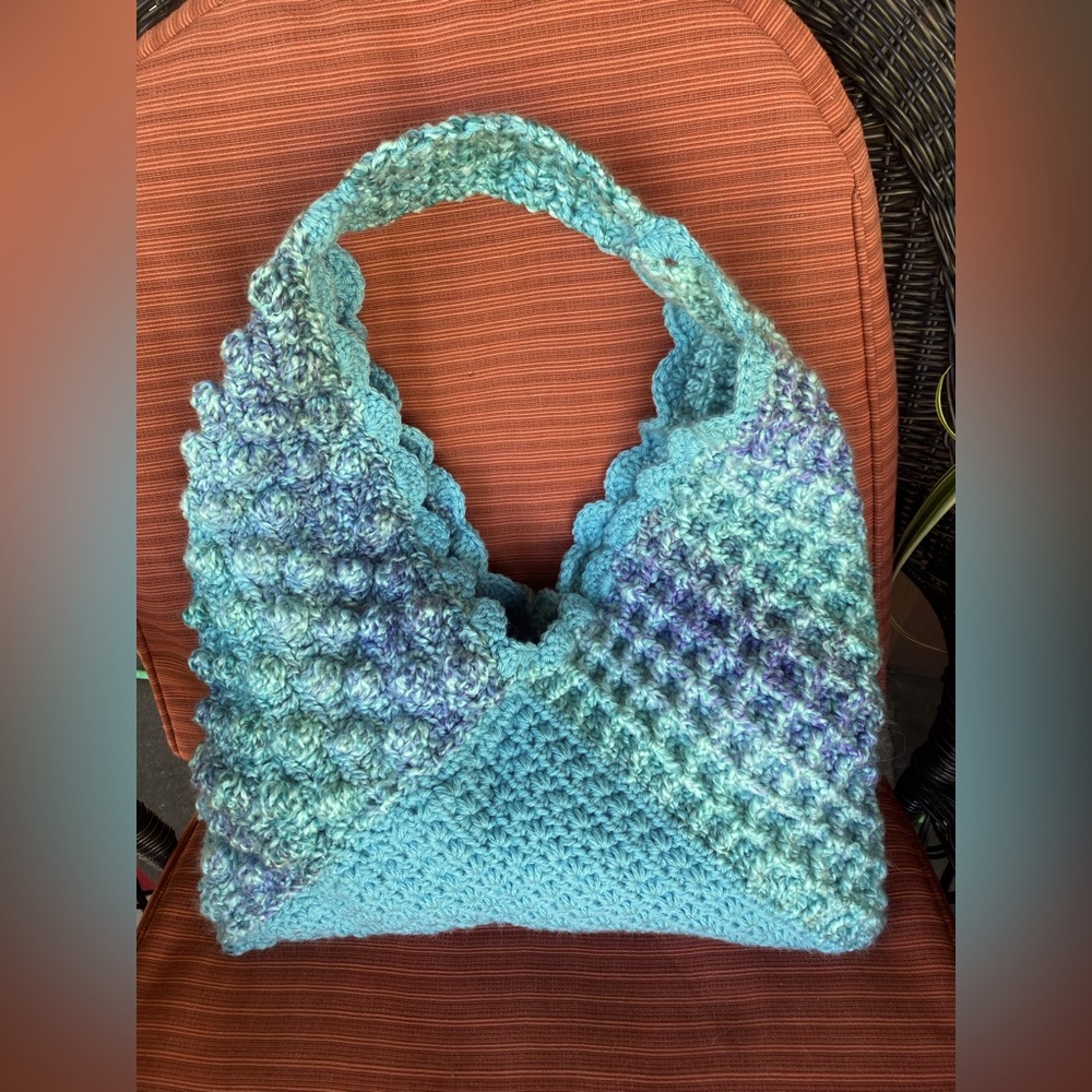 Hand crocheted triangle bucket style tote bag. New.